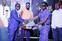 B-RYT on stage with his new management