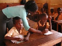 A teache taking her students through lessons