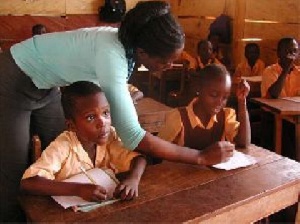 A teache taking her students through lessons