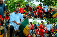 President Mahama drumming with the Rastafarians