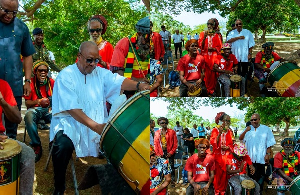 President Mahama drumming with the Rastafarians