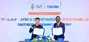 Mr Jack Guo (left) with an official from CAF