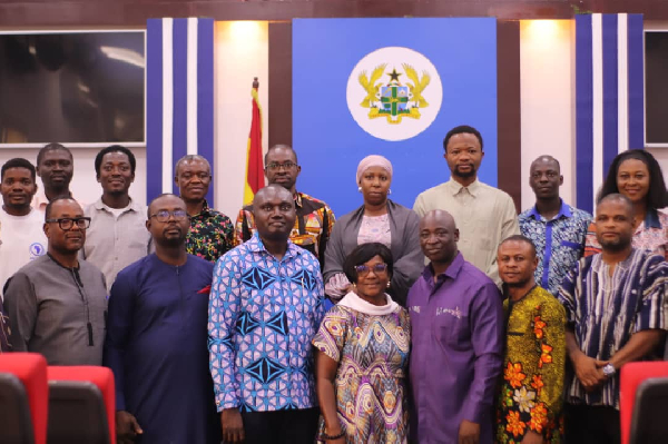 A photo of Parliament Select Committee on Information and Communications and GNA staff