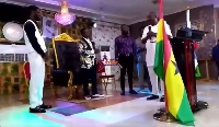 Mahama (holding mic) confers speaking to Opambuor (second left) and his congregation