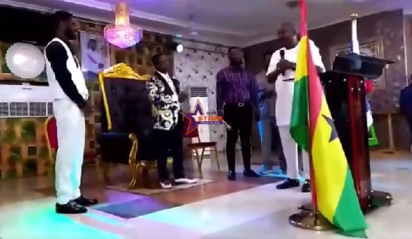 Mahama (holding mic) confers speaking to Opambuor (second left) and his congregation