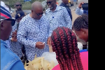 Crowds gather in awe as Mahama stops at a roadside to buy boiled corn