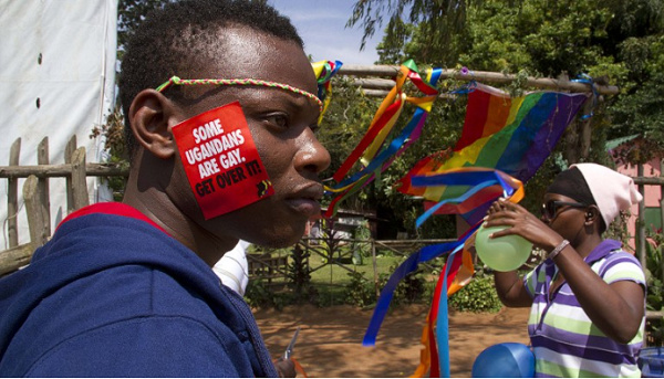 A Ugandan man with a sticker on his face takes part in the annual gay pride in Entebbe, Uganda