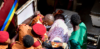 Detained Kizza Besigye is put in an ambulance after he collapsed while attending a court session