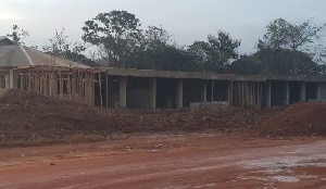 The stores under construction on the school land