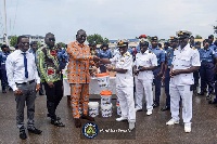 Nana Ofori Atta presenting the items to Eastern Naval Command