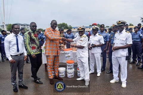 Nana Ofori Atta presenting the items to Eastern Naval Command