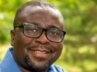 Dr Kofi Akamani was born and raised in Ghana