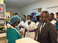 Kwabena Mintah Akandoh interacting with nurses at the hospital
