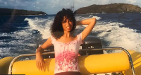 Lisa Philips on a boat with Epstein island for di background