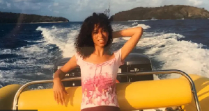 Lisa Philips on a boat with Epstein island for di background