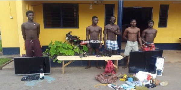 The five suspected thieves and some items retrieved from them