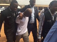 Daniel Asiedu (in white) is standing trial for murder
