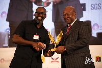 Dr. Edwin Alfred Provencal receiving his recognition from John Dramani Mahama