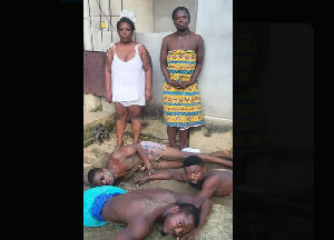 The two rescued women and some of the arrested suspects