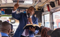 A file photo of A pastor preaching on a bus