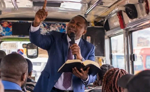 A file photo of A pastor preaching on a bus