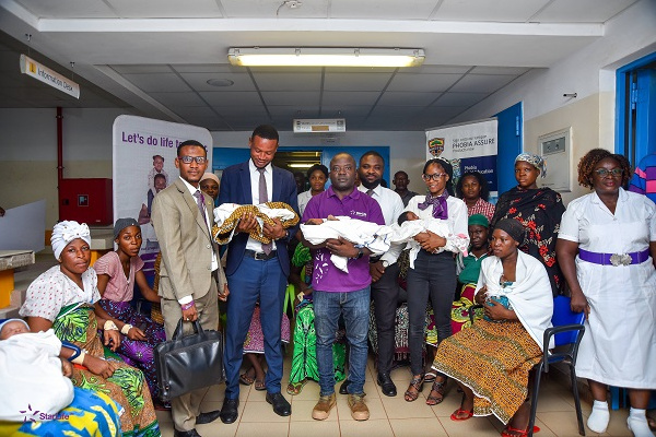 StarLife Assurance officials, staff and beneficiaries during the presentation