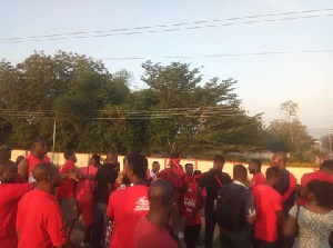 Residents clad in red hit the streets to put pressure on government to complete the footbridges