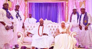 His Royal Majesty,Oba Adeyeye Enitan Ogunwusi Ooni Ojaja II with wife and members of his kingdom
