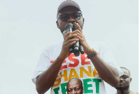 Deputy National Youth Organiser of NDC, Osman Ayariga addressing supporters during the victory walk