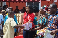 The MP giving out school items to JHS graduates