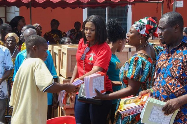 The MP giving out school items to JHS graduates