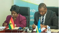Minister for Aviation, Cecilia Abena Dapaah signing the agreement at a ceremony in Rwanda