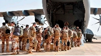 The last French soldiers board a military plane at a base which was handed over to the Nigerien army