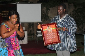 Deborah Dabor Benjamin, philanthropist presenting the citation to Nana Asaase