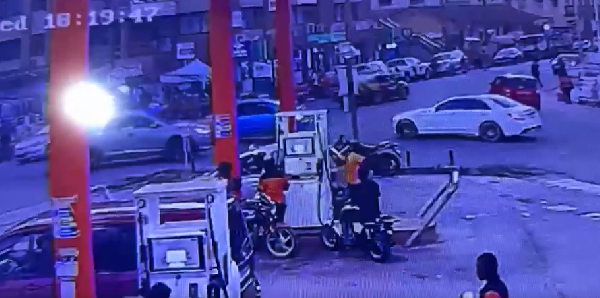 The motor rider pictured buying fuel