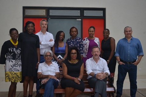 Nadja Bellan-White (sitting in the middle) in a group photo with her team