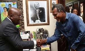 President Nana Addo Dankwa Akufo-Addo in a handshake with Lucky Mensah