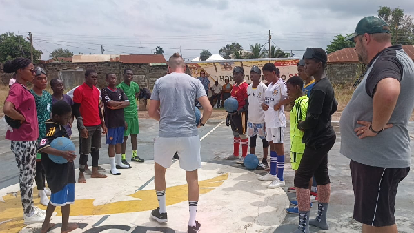 Some individuals engaging in a goalball training session