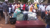 NADMO Officials presenting some items to the affected people