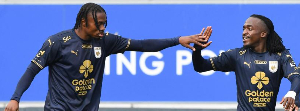 Jerry Afriyie (L) celebrates his goal with a team mate