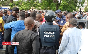 Police and supporters of the NDC face off following the arrest of Koku Anyidoho