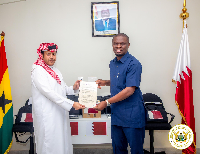 Sports Minister, Mustapha Ussif receiving the items from Mohammed Hamad Al Marri