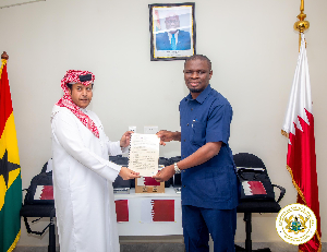 Sports Minister, Mustapha Ussif receiving the items from Mohammed Hamad Al Marri