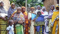 Swahili women dressed in the Kanga cloth. The KANGA is a rectangle of pure cotton cloth with designs
