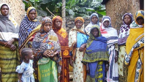 Swahili women dressed in the Kanga cloth. The KANGA is a rectangle of pure cotton cloth with designs