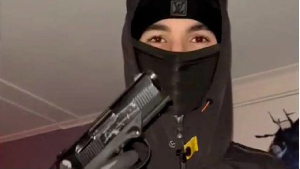 Atilla Azimov posing with a gun three months before he killed Murad Abdelkader