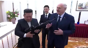 The rilfle is a gift 'just in case enemies appear', Lukashenko tells Kim