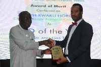 Mr Joseph Kwaku Horgle, Chief Executive of JK Horgle receiving his Merit-Award