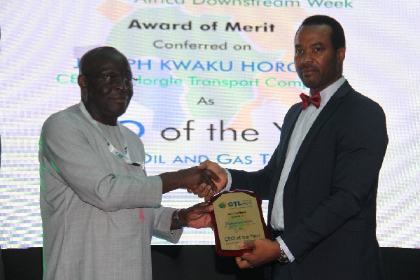 Mr Joseph Kwaku Horgle, Chief Executive of JK Horgle receiving his Merit-Award