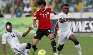 Akaminko and Sumaila tuslling an Egyptian player